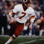 Joe Theismann Autographed 16x20 Looking To Pass Photo- JSA Authenticated