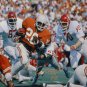 Earl Campbell Autographed 16x20 UT Against OU Sooners Photo- JSA Authenticated