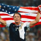 Abby Wambach Autographed 16x20 Holding Flag *Blue Photo- JSA Authenticated