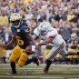 Denard Robinson Autographed 16x20 Avoiding Tackle Photo- JSA W Authenticated