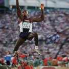 Carl Lewis Autographed 16x20 Front View In Air Photo- JSA W Authenticated