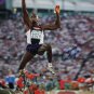 Carl Lewis Autographed 16x20 Front View In Air Photo- JSA W Authenticated