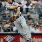 Chipper Jones Autographed 8x10 Braves Throwing Photo- PSA/DNA Authenticated