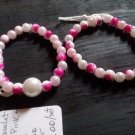 2 pink and white marble bracelets