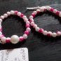 2 pink and white marble bracelets