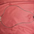 Black necklace with charm