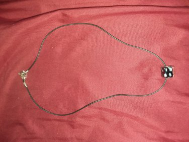 Black necklace with charm