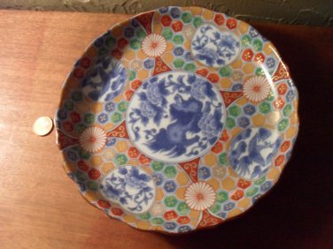 Asian hand painted dish. Signed