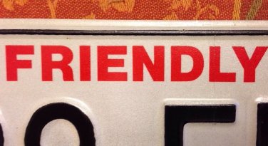 Friendly Manitoba #560 FLH license plate Winnipeg Lake Boreal Forest Canada Bear
