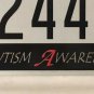 AUTISM SPEAKS Awareness license plate 2445 ASP Autistic Child Cure Puzzle Ribbon