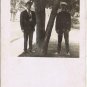 People Postcard RPPC Two Men By Tree Oni In Uniform