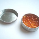45 Golden Bead Units in a tin container
