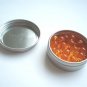 45 Golden Bead Units in a tin container
