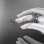 14kt white gold celtic trinity knot engagement ring with a Black Diamond center stone CT789S