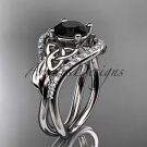 14kt white gold diamond celtic trinity knot engagement ring with a Black Diamond center stone CT7244