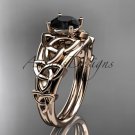 14kt rose gold celtic trinity knot engagement ring with a Black Diamond center stone CT765