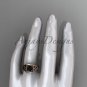 14kt rose gold celtic trinity rope wedding ring with a Black Diamond center stone RPCT964