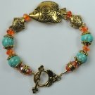handcrafted Turquoise Howlite Bracelet with Orange Crystal and Gold Plated Fishes