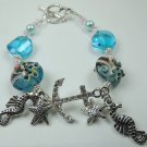 Turquoise Starfish Lampwork Bracelet with Rhinestone Anchor and Metal Silver Tone Charms