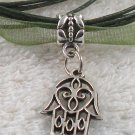 Silver Hansa Hand Charm on a Dark Green Ribbon Necklace