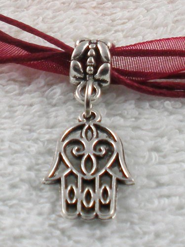 Silver Hansa Hand Charm on a Dark Red Ribbon Necklace
