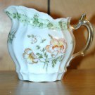 DELICATE CHINA PITCHER WITH PAINTED FLOWERS