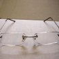 QUALITY READING GLASSES SPRUNG ARM RIMLESS + 1.50  E42