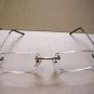 QUALITY READING GLASSES SPRUNG ARM RIMLESS + 1.50  E42