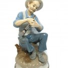Narco Man Playing Horn Sitting on A Rock Figurine Statue Blue