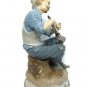 Narco Man Playing Horn Sitting on A Rock Figurine Statue Blue