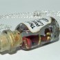 The Road to Power, Bottle Necklace