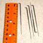 five (5) same size felting needles