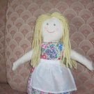 Blond doll with flowered dress