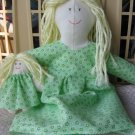 Handcrafted doll in light green dress