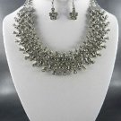 A GOLD PLATED METAL STONES PENDANT NECKLACE SET.   and Earrings
