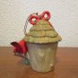 Cardinal perched on a birdhouse Christmas Ornament