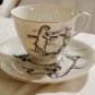 Cup and Saucer Bear and Person Confrontation Robert Mayako Artist