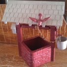 plastic wishing well with bird and bucket vintage decor