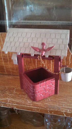 plastic wishing well with bird and bucket vintage decor