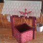plastic wishing well with bird and bucket vintage decor