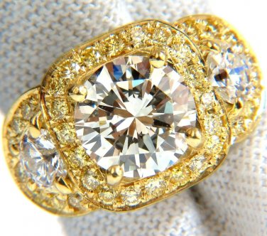 GIA 5.43ct. Brilliant Round Diamond Three stone ring & Fancy Yellows $72,000
