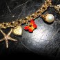 &acirc;��14KT GOLD CHARM BRACELET 10 CHARMS STARFISH CAMEO BUTTERFLY JADE 47.3 grams