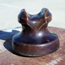 B in a circle brown colored ceramic insulator used