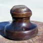 B in a circle brown colored ceramic insulator used