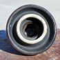 B in a circle brown colored ceramic insulator used