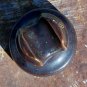 B in a circle brown colored ceramic insulator used