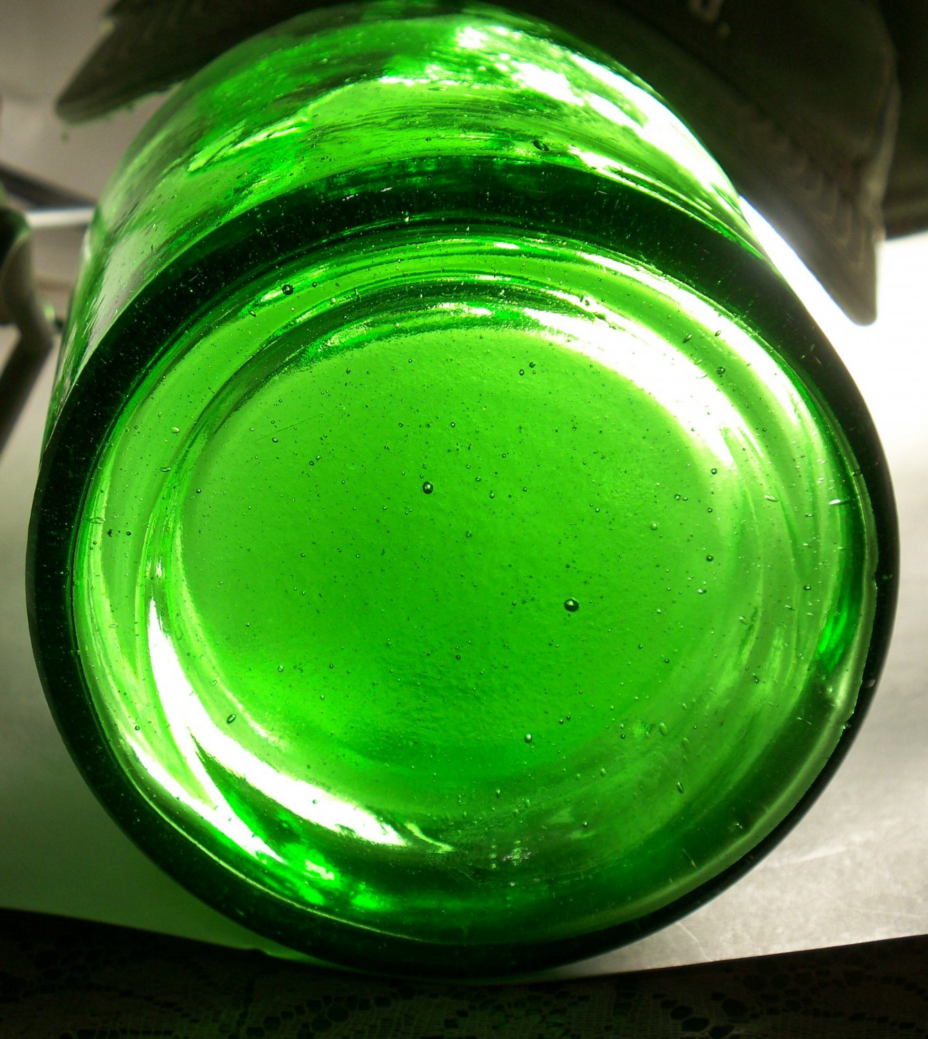 Green bright green wine? bottle bubbles tiny bubbles unknown maker empty