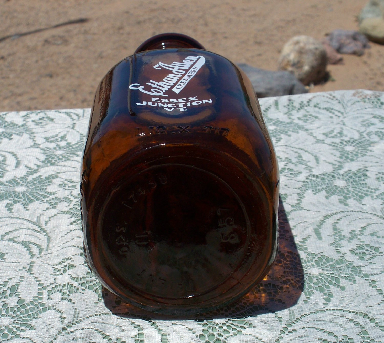 Ethan Allen Creamery Essex Junction, VT. empty brown amber colored