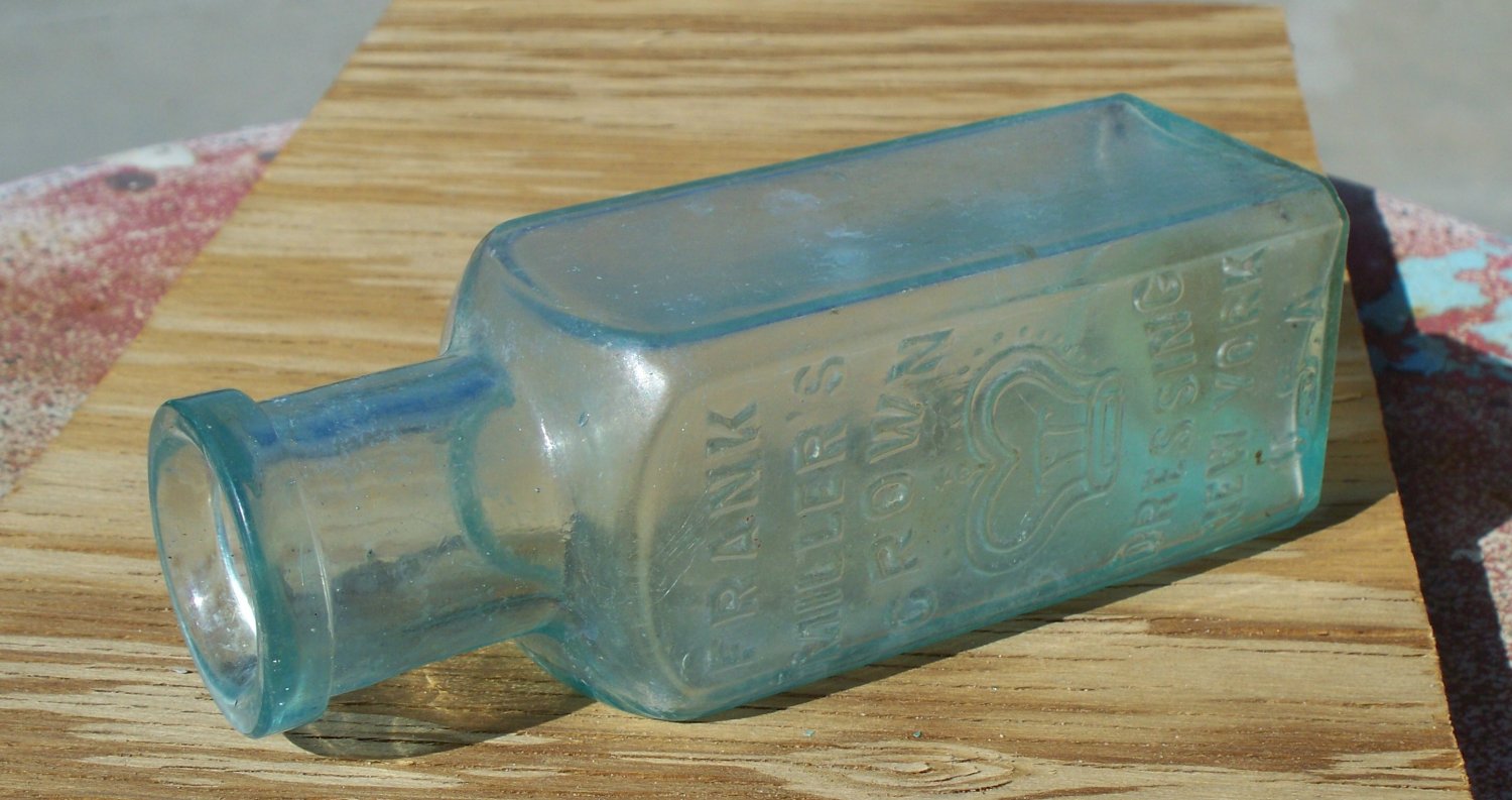 Frank Miller's Crown Dressing New York U. S. A. aqua colored bottle empty