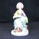 Made in Occupied Japan figurine woman holding a music sheet music